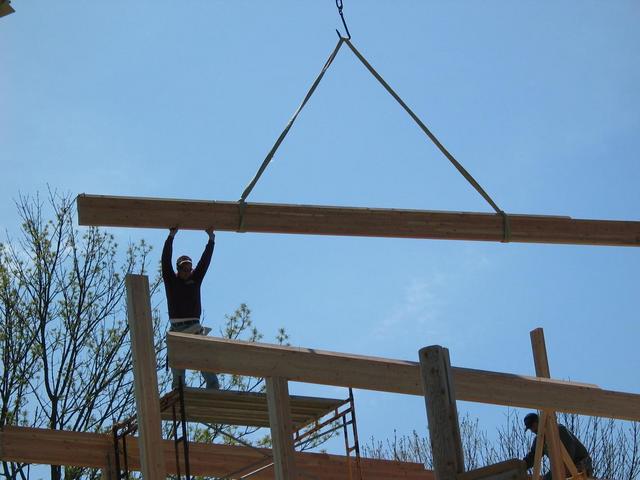 Tom reaching ridge beam.