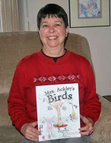 Paige Byard holds a copy of her first published book.